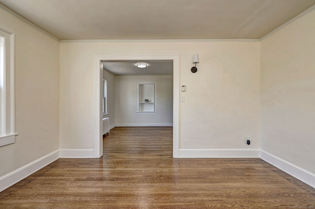 53 Bina Ave, Windsor, CT 06095 - spare room with wood finished floors, crown molding, and baseboards