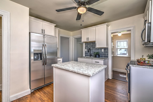 53 Bina Ave, Windsor, CT 06095 - kitchen featuring stainless steel appliances, dark wood-style floors, a center island, white cabinetry, and a ceiling fan