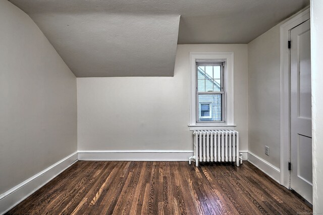 53 Bina Ave, Windsor, CT 06095 - additional living space featuring radiator, wood finished floors, baseboards, and lofted ceiling