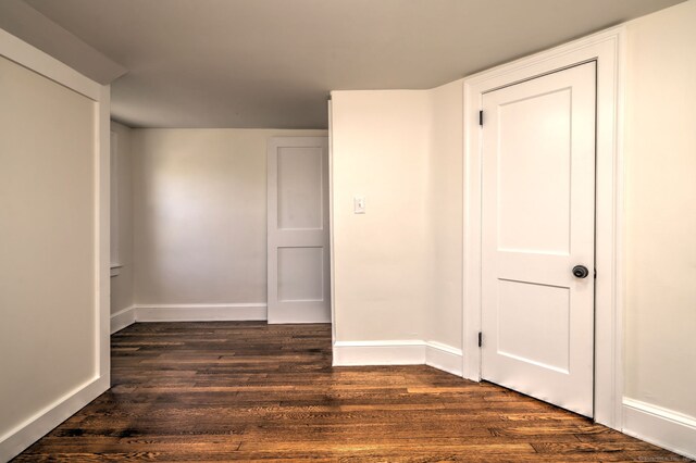 53 Bina Ave, Windsor, CT 06095 - empty room with dark wood-style flooring and baseboards