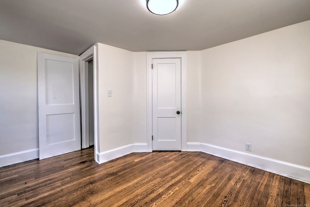 53 Bina Ave, Windsor, CT 06095 - unfurnished bedroom featuring dark wood finished floors, baseboards, and a closet