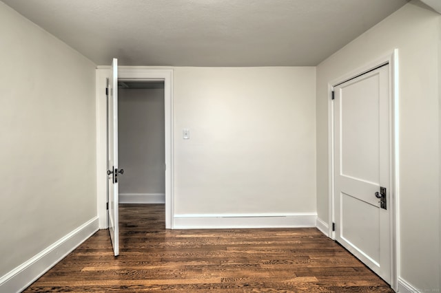 53 Bina Ave, Windsor, CT 06095 - empty room featuring dark wood-type flooring and baseboards