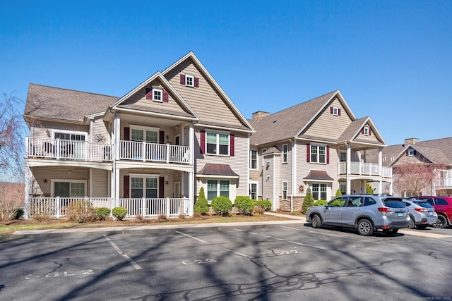 95 S Ridge Ln Unit G103, Berlin, CT 06037 - view of front of house with a balcony, a porch, and uncovered parking