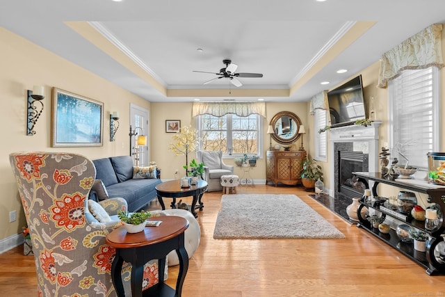 95 S Ridge Ln Unit G103, Berlin, CT 06037 - living area featuring a premium fireplace, wood finished floors, a raised ceiling, and crown molding