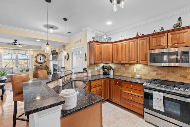95 S Ridge Ln Unit G103, Berlin, CT 06037 - kitchen with open floor plan, backsplash, appliances with stainless steel finishes, and a sink