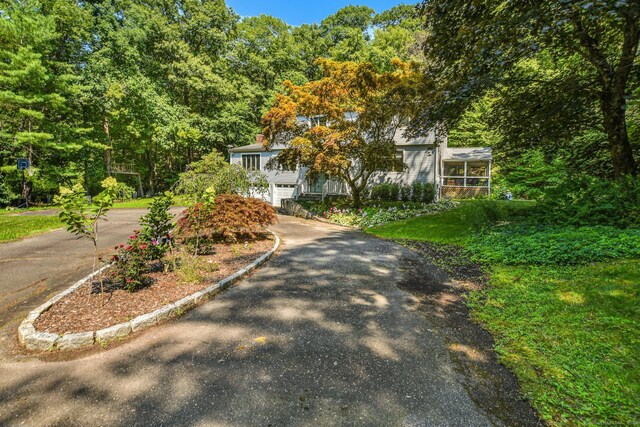 8 Oak Ln, Weston, CT 06883 - view of front of home featuring aphalt driveway and a garage