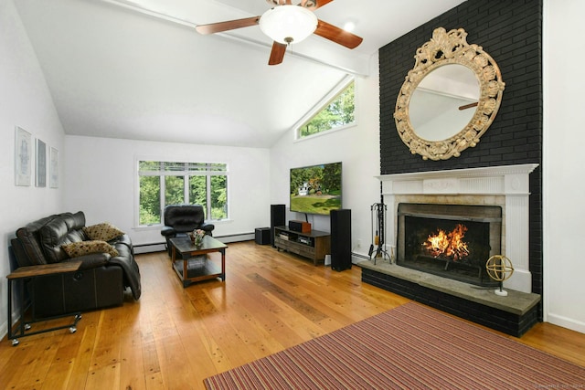 8 Oak Ln, Weston, CT 06883 - living room featuring wood-type flooring, a wealth of natural light, a baseboard radiator, and a fireplace