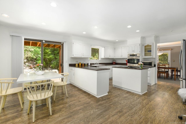 8 Oak Ln, Weston, CT 06883 - kitchen with recessed lighting, a sink, dark wood-type flooring, appliances with stainless steel finishes, and white cabinetry
