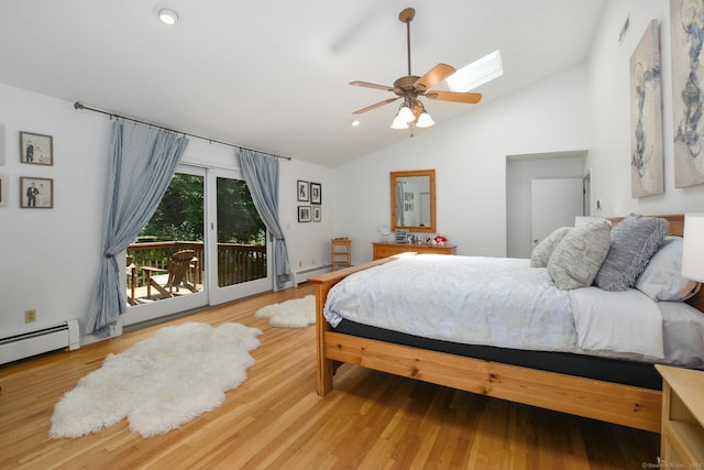 8 Oak Ln, Weston, CT 06883 - bedroom featuring a baseboard heating unit, access to exterior, recessed lighting, vaulted ceiling with skylight, and wood finished floors