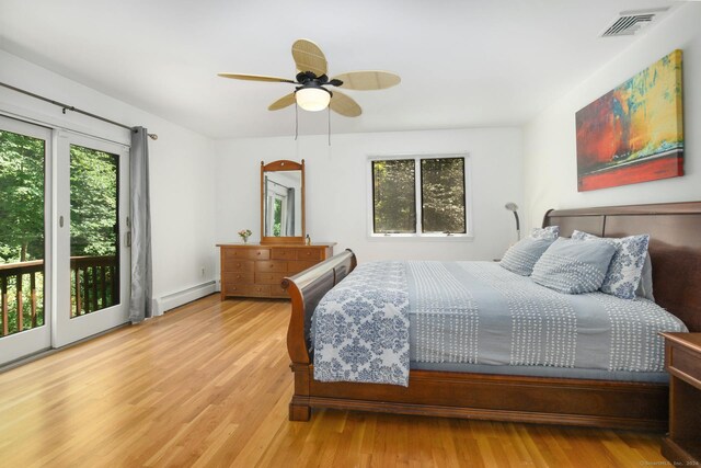 8 Oak Ln, Weston, CT 06883 - bedroom featuring access to exterior, visible vents, baseboard heating, wood finished floors, and a ceiling fan