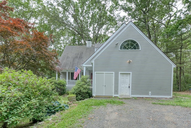 615 Jackson St, Thomaston, CT 06787 - view of front of house with a chimney and roof with shingles