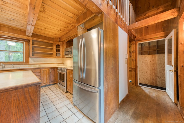 615 Jackson St, Thomaston, CT 06787 - kitchen featuring stainless steel appliances, wood ceiling, light countertops, brown cabinetry, and open shelves