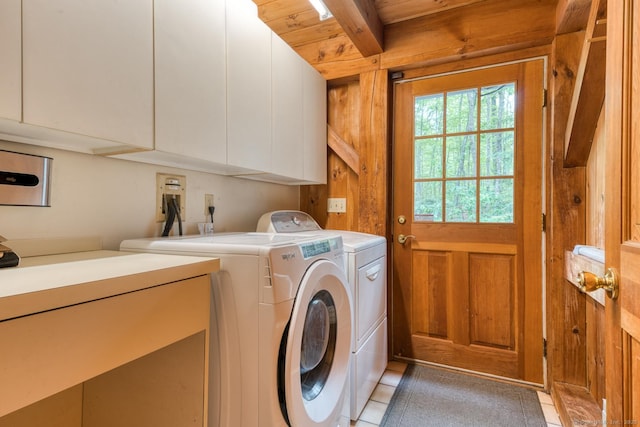 615 Jackson St, Thomaston, CT 06787 - laundry room featuring cabinet space, independent washer and dryer, wooden walls, and light tile patterned flooring
