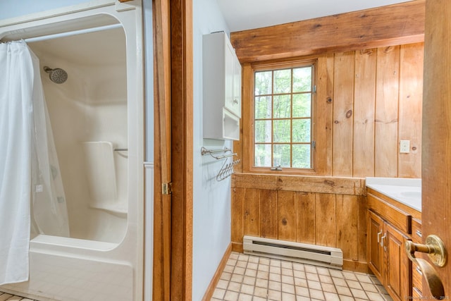 615 Jackson St, Thomaston, CT 06787 - bathroom with baseboard heating, wood walls, and vanity