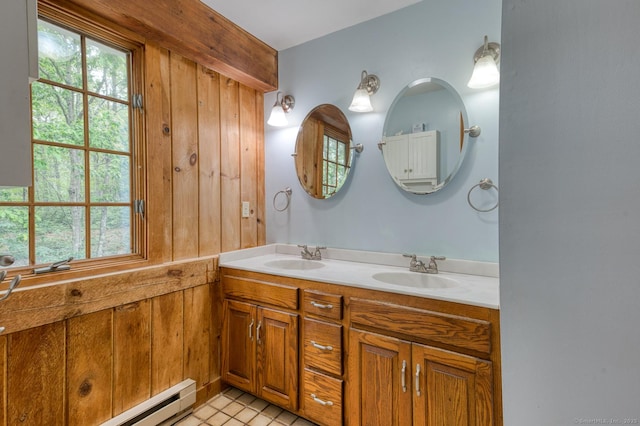 615 Jackson St, Thomaston, CT 06787 - bathroom featuring double vanity and a baseboard radiator