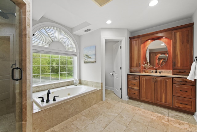 full bath featuring vanity, a jetted tub, a shower stall, and visible vents
