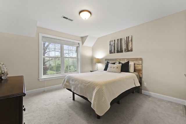 bedroom with baseboards, carpet flooring, and visible vents