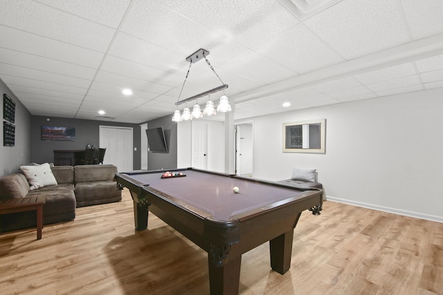 rec room with light wood-style floors, pool table, baseboards, and a drop ceiling