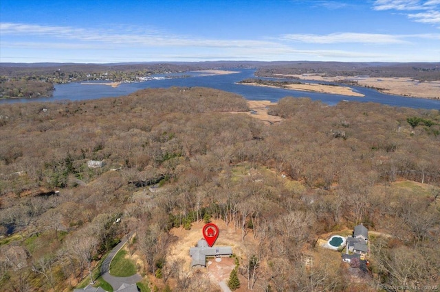 aerial view with a wooded view and a water view