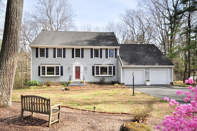 187 Hollister Dr, Avon, CT 06001 - colonial-style house with an attached garage, a front lawn, and driveway