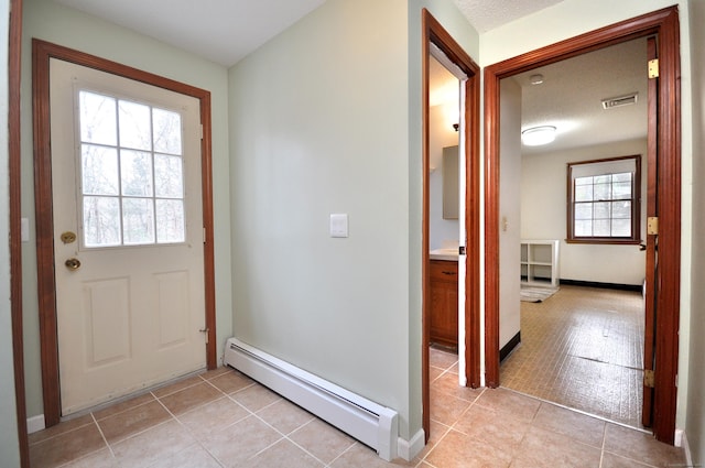 187 Hollister Dr, Avon, CT 06001 - entryway with baseboards, visible vents, a baseboard radiator, and light tile patterned flooring