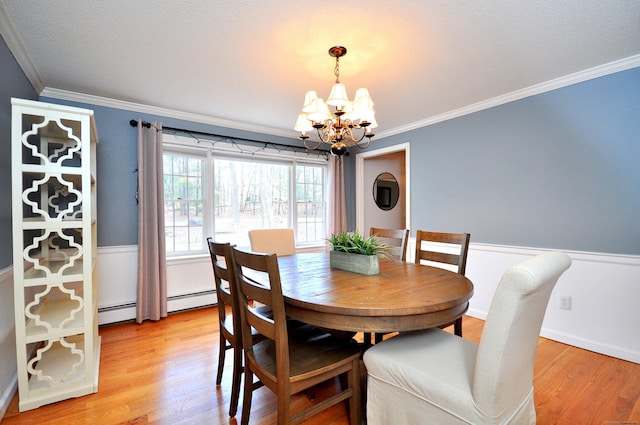 187 Hollister Dr, Avon, CT 06001 - dining area featuring light wood-type flooring, baseboard heating, an inviting chandelier, and ornamental molding
