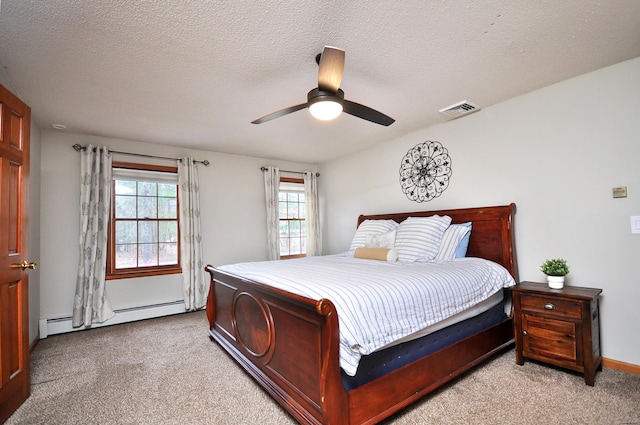 187 Hollister Dr, Avon, CT 06001 - carpeted bedroom with a baseboard radiator, a textured ceiling, ceiling fan, baseboards, and visible vents