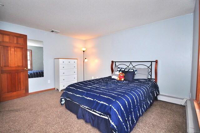187 Hollister Dr, Avon, CT 06001 - carpeted bedroom featuring a baseboard heating unit, visible vents, and baseboards