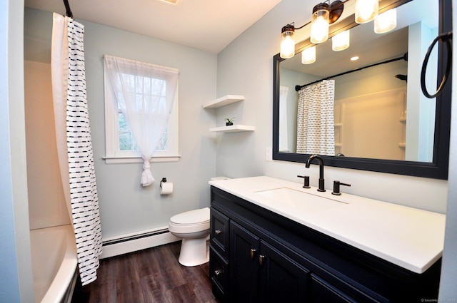 187 Hollister Dr, Avon, CT 06001 - bathroom with baseboard heating, toilet, vanity, and wood finished floors