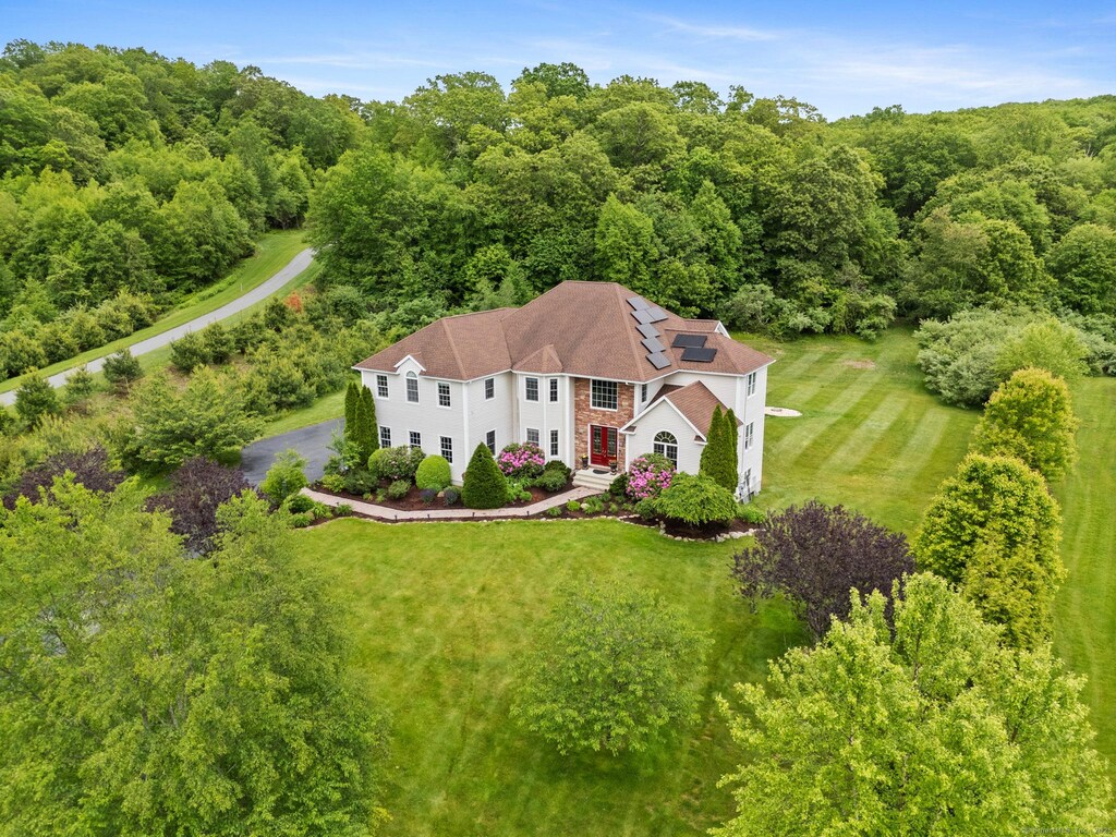 19 Rocco Dr, East Lyme, CT 06333 - aerial view of property and surrounding area with a forest