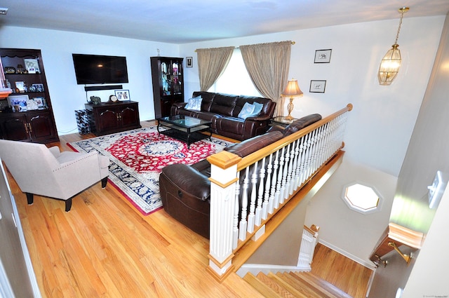 living room with wood finished floors and baseboards
