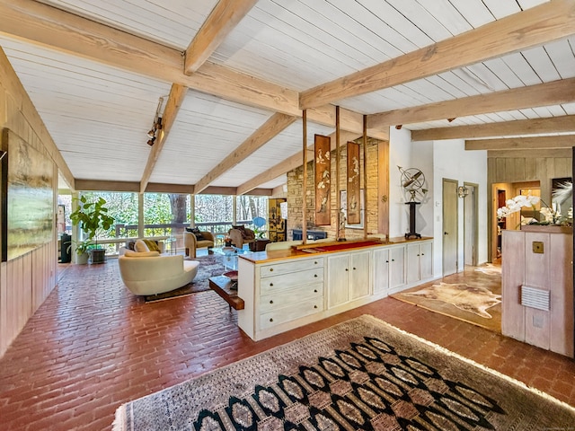 1177 Rock Rimmon Rd, Stamford, CT 06903 - kitchen featuring open floor plan, wooden walls, brick floor, and vaulted ceiling with beams
