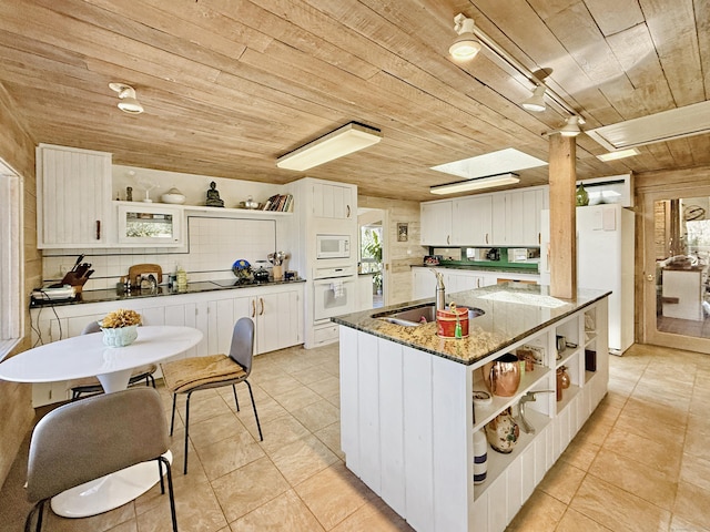 1177 Rock Rimmon Rd, Stamford, CT 06903 - kitchen with wooden ceiling, white appliances, light tile patterned floors, open shelves, and a sink