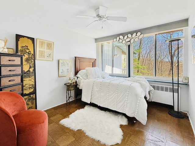 1177 Rock Rimmon Rd, Stamford, CT 06903 - bedroom featuring radiator, a ceiling fan, and multiple windows