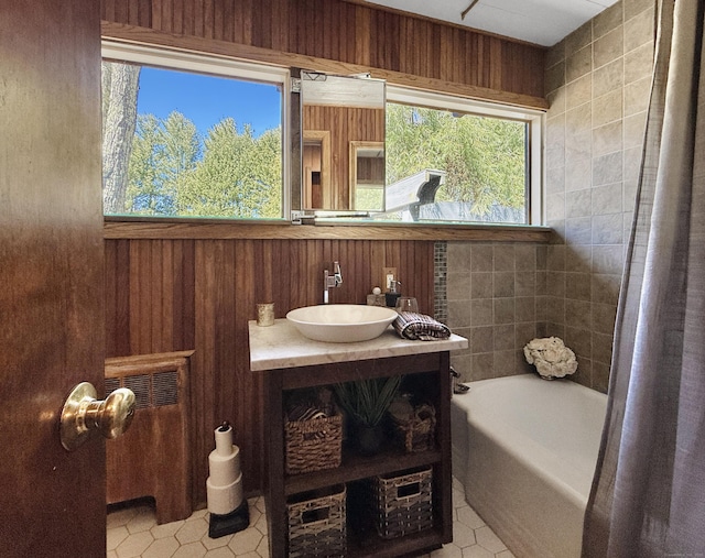 1177 Rock Rimmon Rd, Stamford, CT 06903 - full bathroom with wood walls, vanity, and tile patterned floors