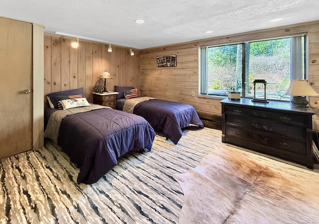 1177 Rock Rimmon Rd, Stamford, CT 06903 - bedroom featuring a textured ceiling, wooden walls, and wood finished floors