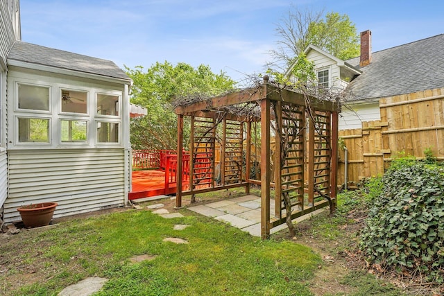 view of yard featuring a wooden deck, a patio area, and stairway