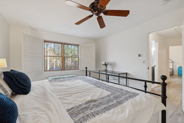bedroom featuring a ceiling fan and wood finished floors