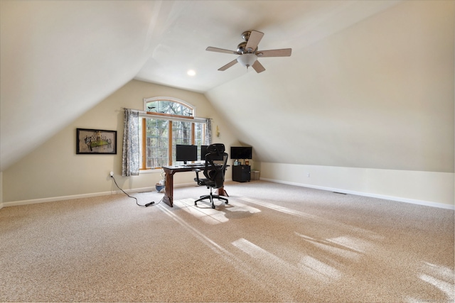 home office with lofted ceiling, a ceiling fan, carpet, and baseboards