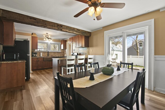 3 Cedar Crest Pl, Norwalk, CT 06854 - dining room featuring wainscoting, wood finished floors, and ceiling fan with notable chandelier