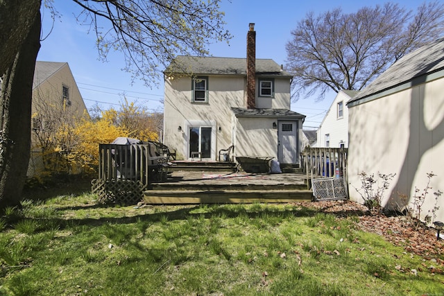 3 Cedar Crest Pl, Norwalk, CT 06854 - rear view of house with stucco siding, a chimney, a yard, and a deck