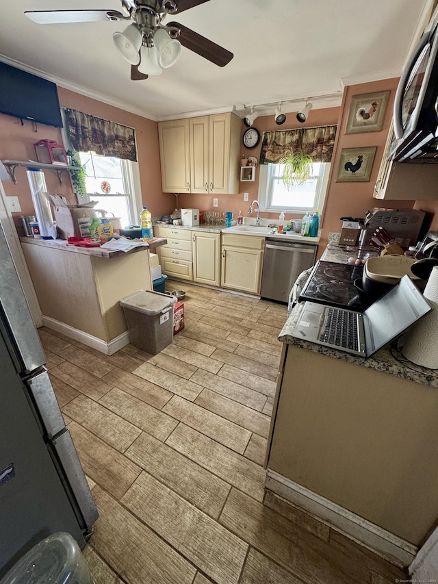 kitchen with stainless steel appliances, open shelves, a ceiling fan, ornamental molding, and cream cabinets