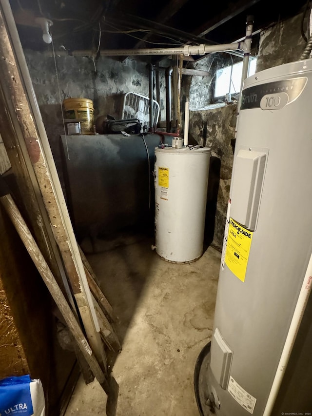 utilities with gas water heater, heating fuel, and electric water heater