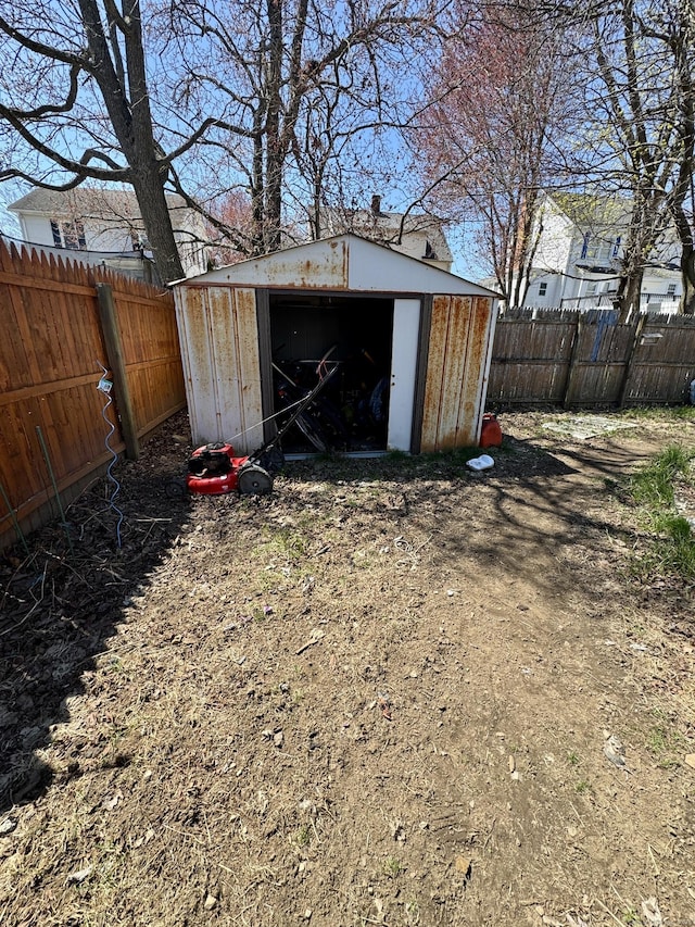 view of shed featuring a fenced backyard