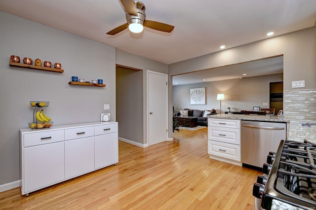 245 Paradise Ave, Hamden, CT 06514 - kitchen with light wood finished floors, dishwasher, white cabinetry, open floor plan, and a ceiling fan