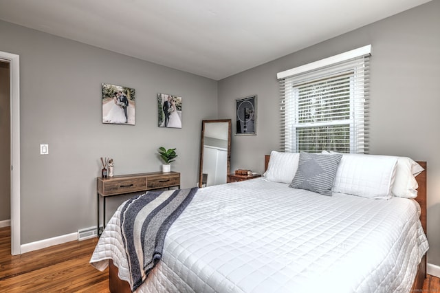 245 Paradise Ave, Hamden, CT 06514 - bedroom with baseboards, wood finished floors, and visible vents
