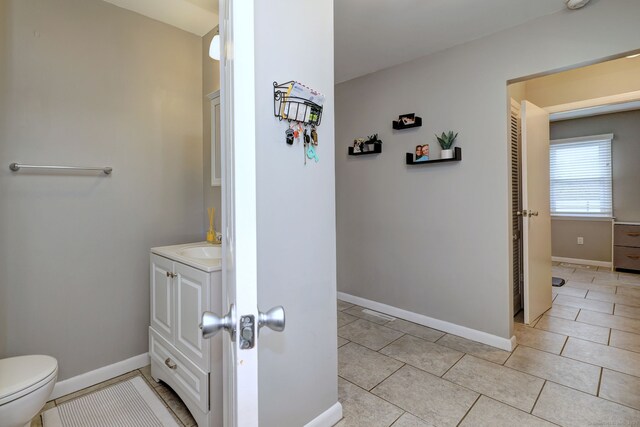245 Paradise Ave, Hamden, CT 06514 - bathroom with toilet, baseboards, tile patterned floors, and vanity