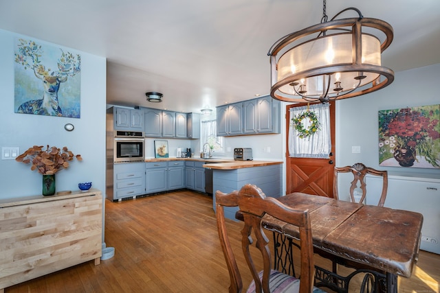 43 Greene Ave, North Canaan, CT 06018 - dining space with wood-type flooring and a chandelier