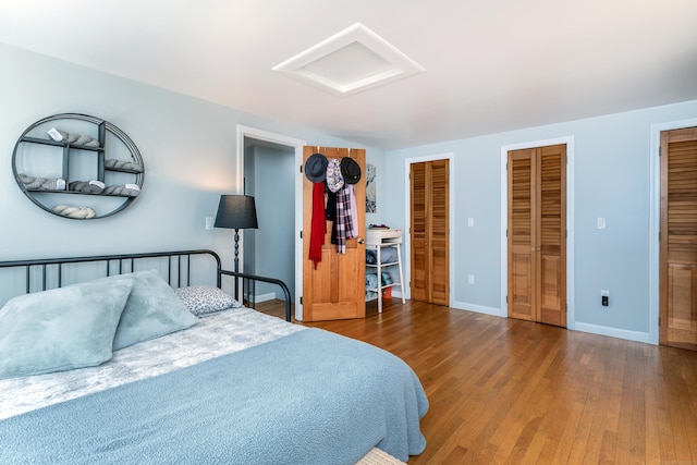 43 Greene Ave, North Canaan, CT 06018 - bedroom with attic access, multiple closets, wood finished floors, and baseboards