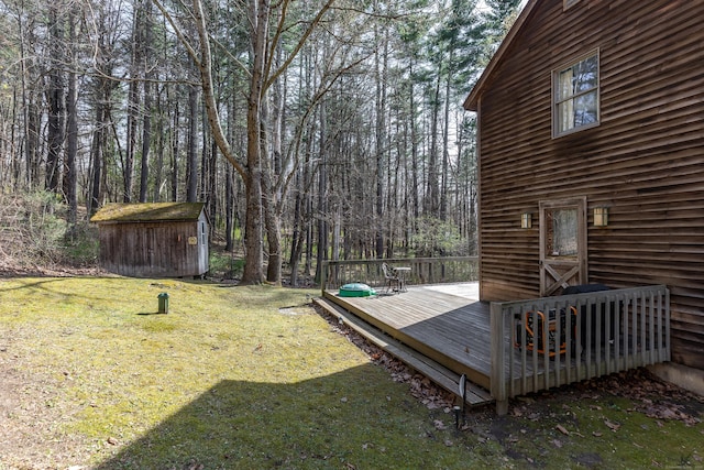 43 Greene Ave, North Canaan, CT 06018 - view of green lawn featuring a shed, a deck, an outdoor structure, and a view of trees